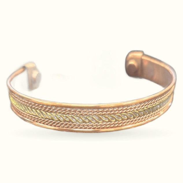 Gold and copper magnetic cuff bracelet with detailed chevron pattern design