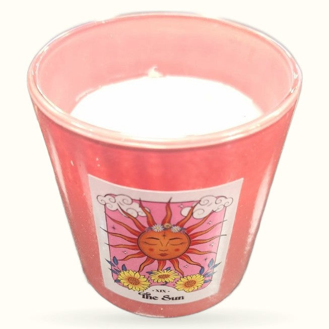 Pink rose quartz chip candle in glass jar with The Sun tarot card label design