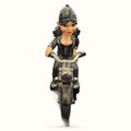 Biker Chick Ornament featuring a female figurine in black leather jacket on a motorcycle