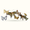 Decorative butterfly wall hangers in gold, brown, and blue metallic finishes arranged in a group