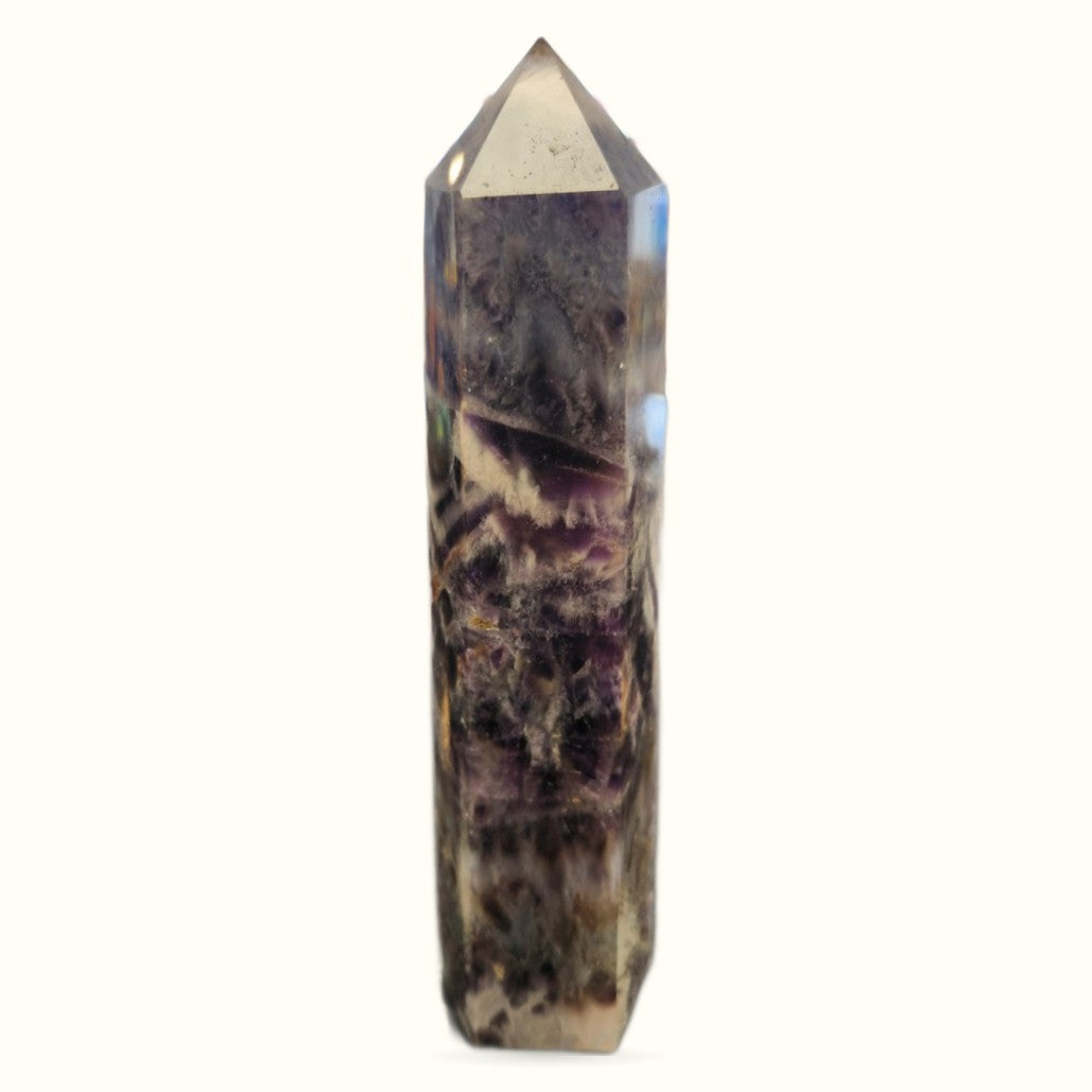 Chevron Amethyst tower with pointed top, deep purple and white banded patterns, polished finish