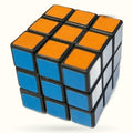 Mini Rubik's Cube with orange top face, blue front and left faces, black ridges on white background