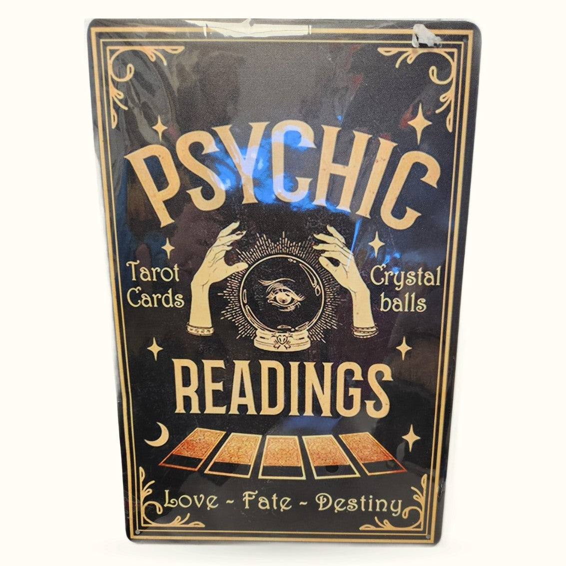 Vintage-style black tin sign with gold text reading 'Psychic Readings' featuring crystal ball and tarot imagery
