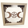 Square wooden plaque with triple moon phases and pentagram symbol in walnut frame