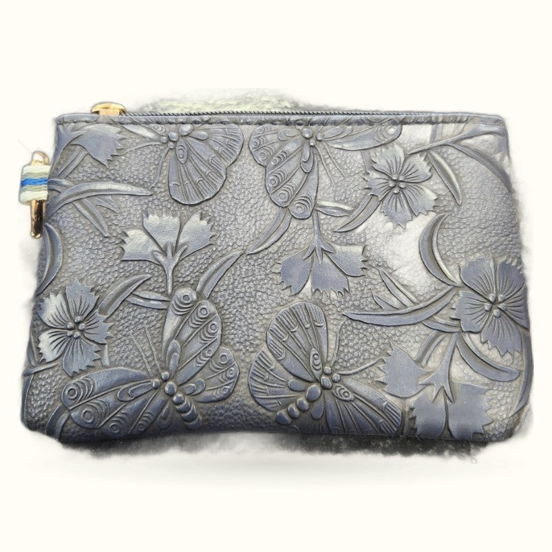 Grey leather purse with embossed floral and butterfly design and gold zip keychain