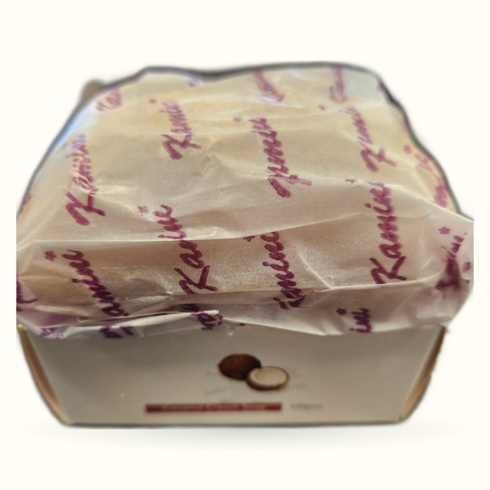 Coconut Cream Soap by Kamini in cream-colored cardboard box with purple text branding