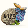 Stone Hope Rock garden ornament with colorful blue and pink hydrangea flowers and golden butterfly