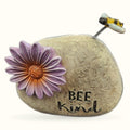 Bee Kind stone garden ornament with purple flower and bobble-head bee on spring