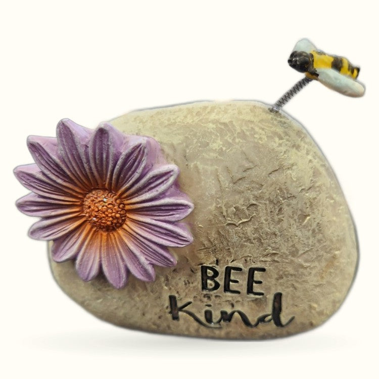 Bee Kind stone garden ornament with purple flower and bobble-head bee on spring