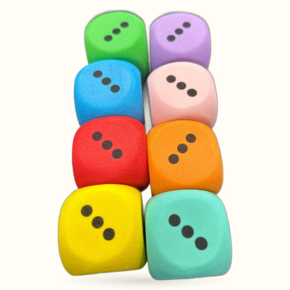 Ten colorful foam dice arranged in a pyramid formation, each showing three dots on visible faces.