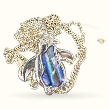 Silver penguin necklace pendant with iridescent blue paua shell belly on silver chain