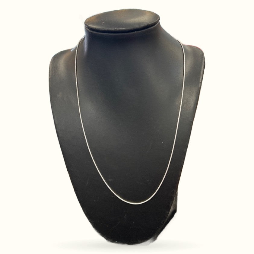 Silver snake chain necklace displayed on black mannequin bust, showing full 76cm length