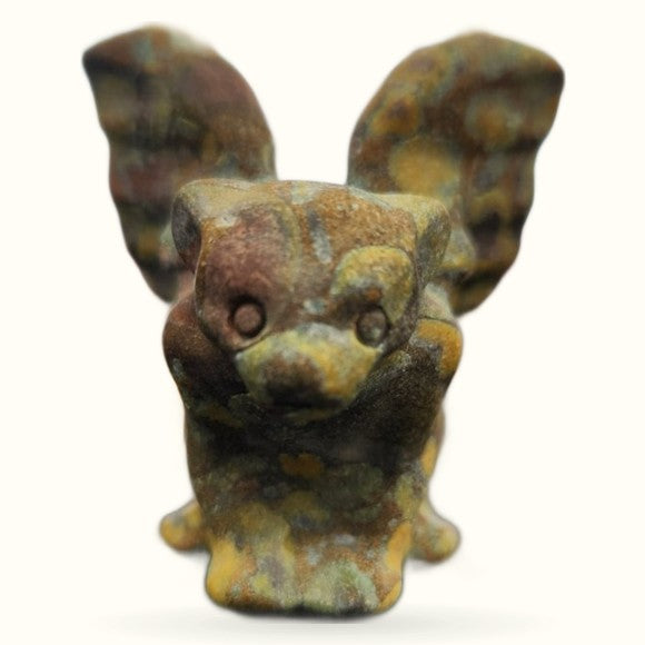 Bamboo Jasper gargoyle figurine with pointed ears, round eyes, and weathered brown-gold patina finish