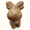Red Network Jasper carved into a small animal figurine with rounded body and pointed ears