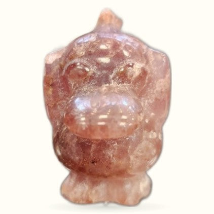 Strawberry quartz carved duck figurine with translucent peachy-pink coloring and glossy finish