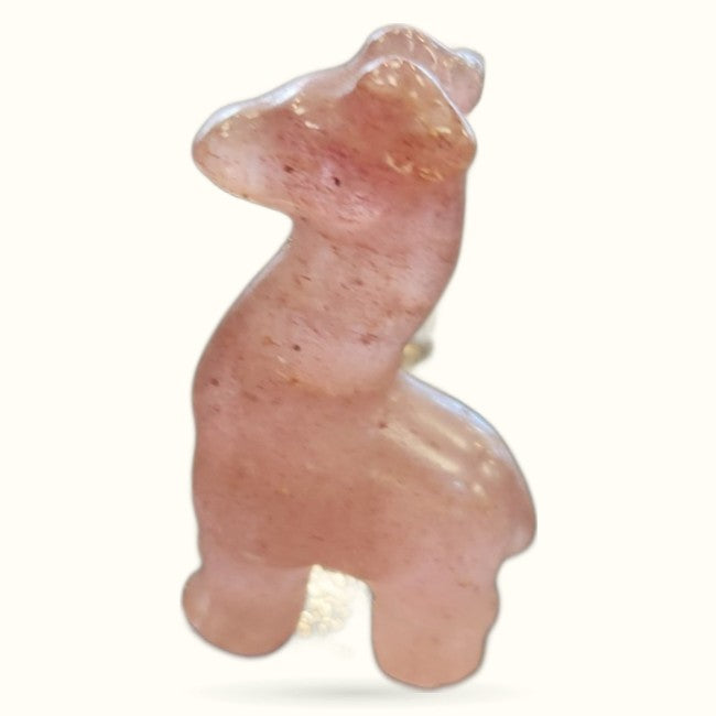 Polished strawberry quartz llama carving with peachy-pink coloring and glossy finish