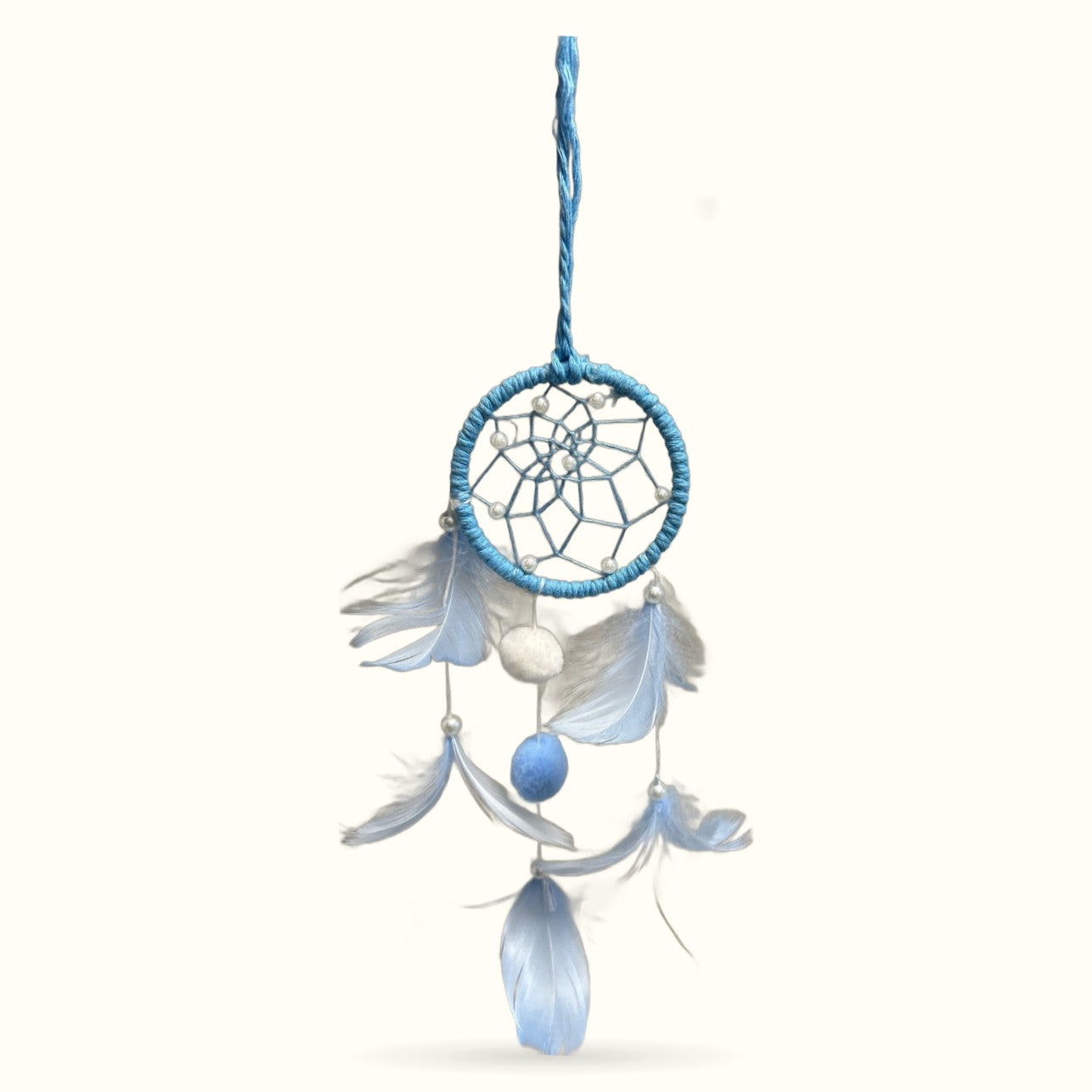 Small blue dreamcatcher with wrapped ring, web design, feathers and pom pom beads hanging