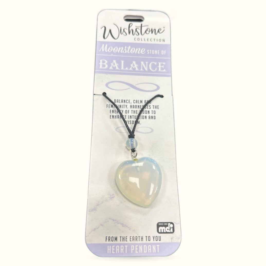 Moonstone heart pendant necklace on black cord with product packaging from Wishstone Collection