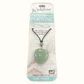 Green aventurine heart pendant on black cord with small bead detail, displayed on branded packaging