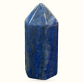 Polished lapis lazuli crystal point with deep blue color and golden pyrite flecks