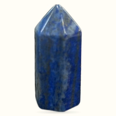 Polished lapis lazuli crystal point with deep blue color and golden pyrite flecks