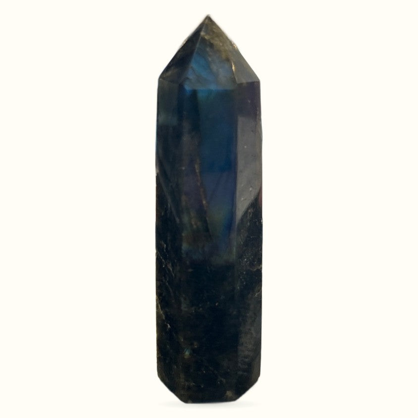 Polished labradorite point crystal with dark base and pointed tip, displaying blue iridescence