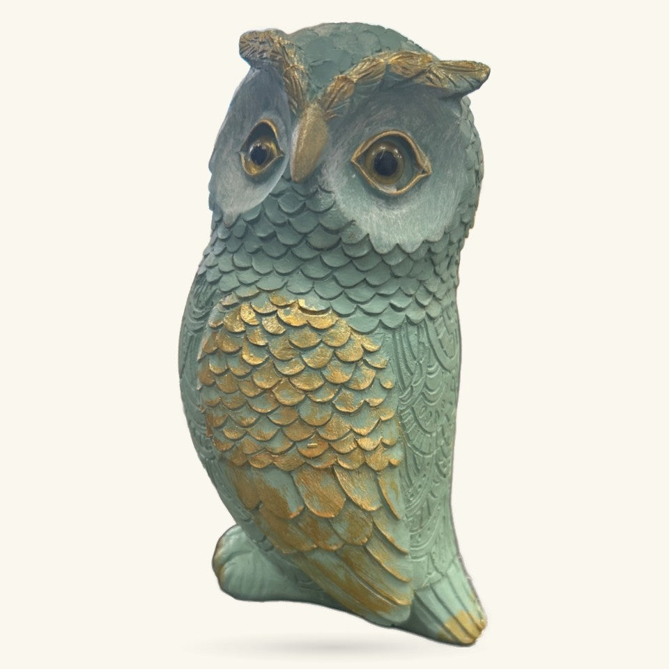 Blue and gold decorative owl ornament with detailed feather carving and golden eye rings