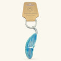 Blue agate slice keychain with silver ring and chain, attached to EarthInspired branded cardboard tag