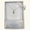 Silver cross pendant necklace in Equilibrium branded box with rose gold heart pattern