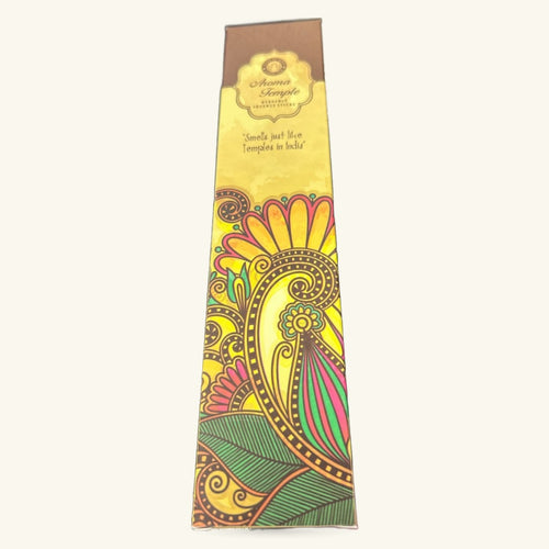 Aroma Temple incense box with yellow background and colorful Indian-inspired floral design