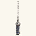 Silver-capped sodalite pendulum with blue stone interior, suspended from a delicate chain
