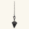 Black obsidian point pendulum hanging from silver chain with lobster clasp against neutral background