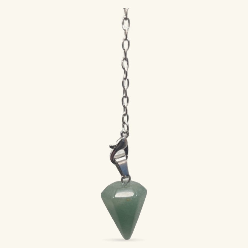 Green aventurine pointed pendulum on silver chain with clasp against cream background
