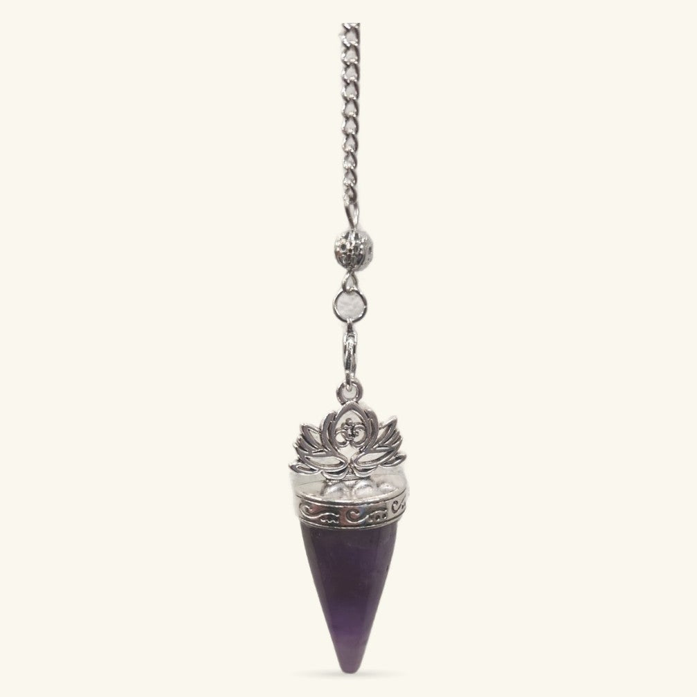 Amethyst Lotus Pendulum with silver chain and decorative lotus flower cap on dark purple stone point