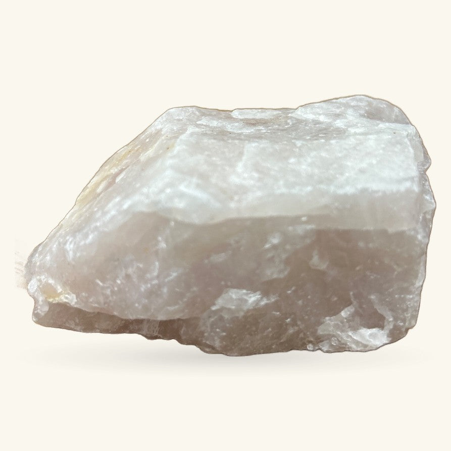 Raw rose quartz crystal specimen, 448g, showing pale pink and white translucent layers against neutral background