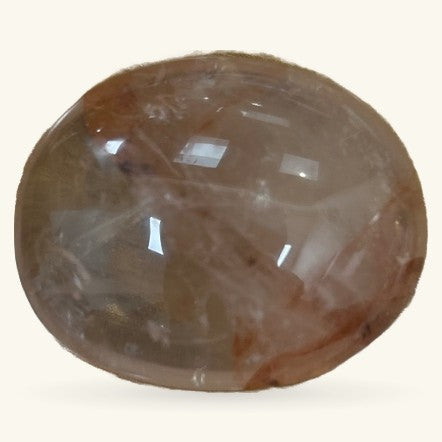 Polished brown fire quartz palmstone with glossy finish and natural striations