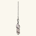 Rose quartz pendulum with spiraling metal wire wrap suspended from silver chain