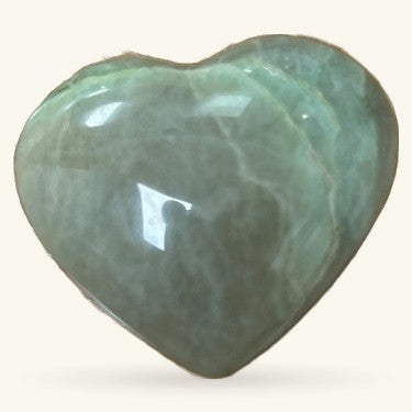 Polished green amazonite heart crystal with natural striations and glossy finish