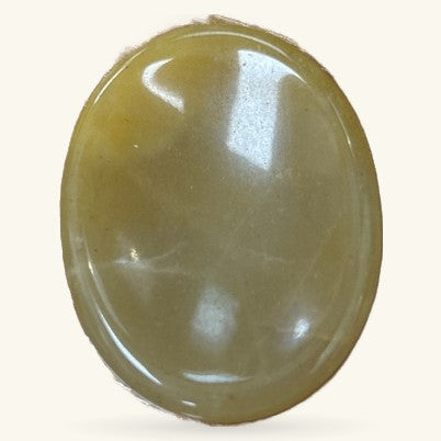 Polished oval citrine worry stone with warm golden-yellow tone and glossy finish