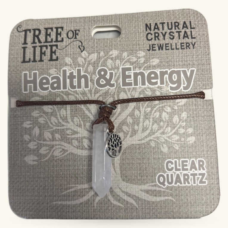 Clear quartz point pendant on brown cord with Tree of Life charm, displayed on Health & Energy branded card