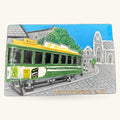 Green and yellow Christchurch tram magnet featuring vintage tram design with cathedral building backdrop