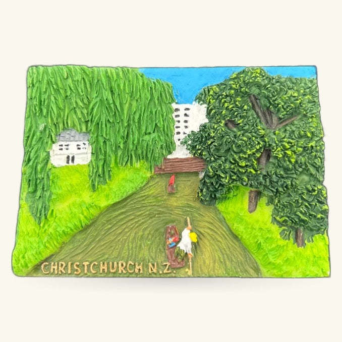 Christchurch N.Z. souvenir magnet showing rural scene with willow tree, houses, and figures on country road
