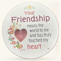 Round cream magnet with heart cutout, floral design, and friendship message in burgundy and pink text