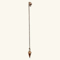 Rose gold metal dowsing pendulum with chain and pointed cone weight on white background