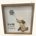Wooden framed plaque with textured dog figurine holding string attached to grey felt flower, 'HOME is WHERE THE DOG IS' text