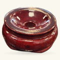 Deep burgundy wooden crystal sphere stand with polished finish and gold trim