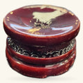 Burgundy wooden crystal sphere stand with decorative metal band and cream inlay detail