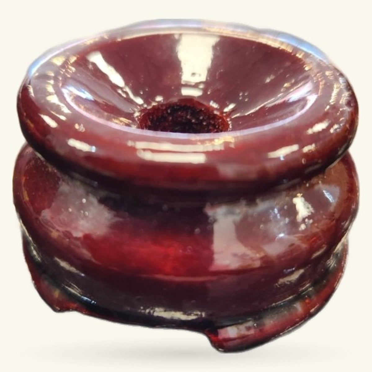 Burgundy wooden crystal sphere stand with glossy finish and circular top opening, shown from angled view