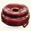 Burgundy wooden crystal sphere stand with glossy finish and small notch detail