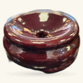 Burgundy wooden crystal sphere stand with cream inlay details, round bowl shape with central hole